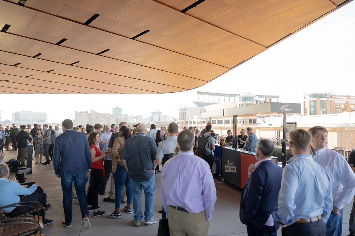Attendees Networking at Moody Center Terrace