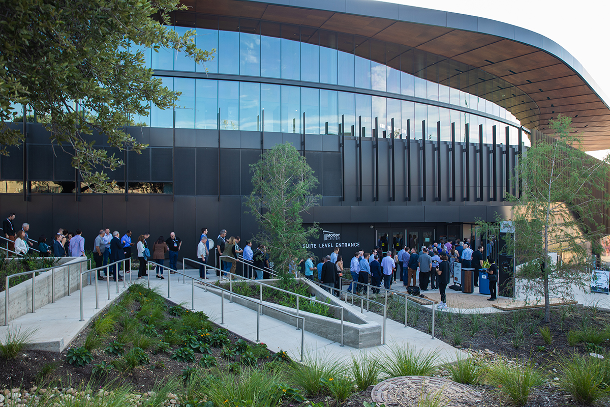 Moody Center exterior with attendees walking in.